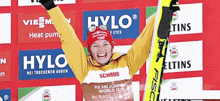 a woman in a yellow jacket with the word hylo on the front