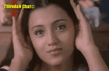 a close up of a woman 's face with the words " thirudan chat " on the bottom