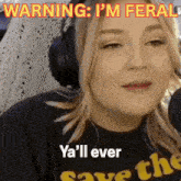 a woman wearing headphones says warning i 'm feral ya 'll ever save the world