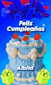 a blue and white cake with strawberries and the words feliz cumpleanos above it