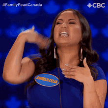 a woman with a name tag that says anneluzella on it