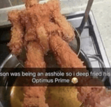 a picture of fried chicken with a caption that says son was being an asshole so i deep fried his optimus prime