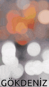a blurred image with the word gökdeniz on the bottom