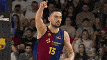 a basketball player wearing a jersey with the number 13