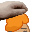 a hand is holding a piece of bread on top of a cartoon character .