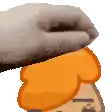 a hand is holding a piece of bread on top of a cartoon character .