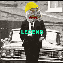 a man in a suit and tie is standing in front of a car with the word legend written on it