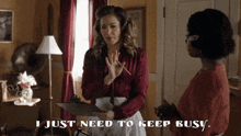 a woman holding a clipboard with the words " i just need to keep busy " below her