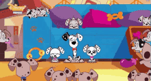 a group of dalmatian dogs are sitting in front of a blue couch with disney premiere written on the bottom