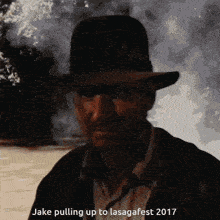 a man wearing a hat is pulling up to lasagafest 2017