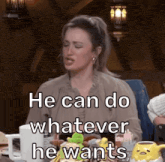 a woman is sitting at a table with stuffed animals and says he can do whatever he wants