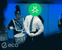 a man in a marching band has a green circle on his head that says ' x '