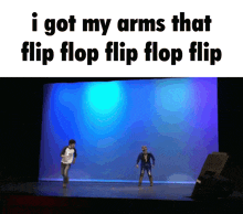 a picture of two people dancing on a stage with the caption i got my arms that flip flop flip flop flip
