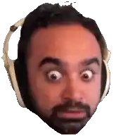 a man with a beard wearing headphones is making a surprised face .