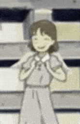 a girl in a white dress is standing in front of a stack of books .