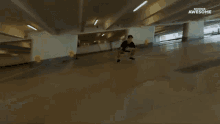 a skateboarder is doing a trick in a parking garage and the words awesome are on the screen
