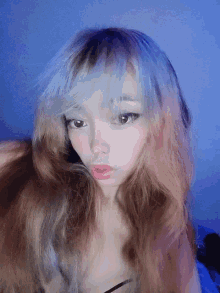 a close up of a woman 's face with long hair