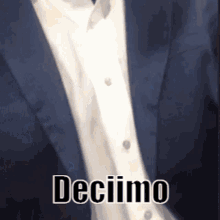 a man in a suit and tie is wearing a white shirt with the words decimo written on it .