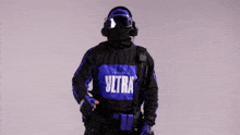 a person wearing a purple and black shirt that says ultra