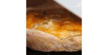 a close up of a pizza with cheese and tomatoes