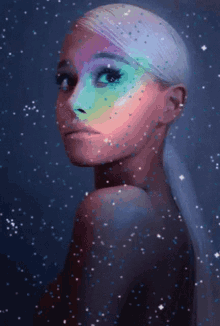 a close up of a woman 's face with rainbow makeup