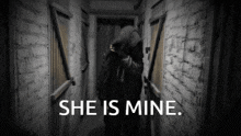 a black and white photo of a person with the words she is mine