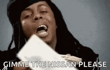 a man with dreadlocks is holding a bunch of money in his hand and says `` gimme the nissan please '' .