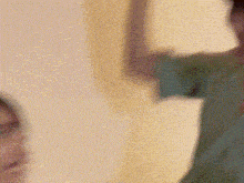 a close up of a person 's face with a yellow background