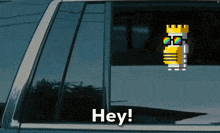 a blue car with a sticker on the window that says hey
