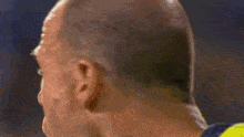 a close up of a man 's face with sweat coming out of his mouth
