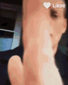 a close up of a person 's face with a likee icon on it