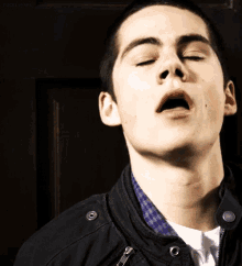 a close up of a man with his mouth open