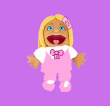 a puppet with blonde hair and blue eyes is wearing pink overalls