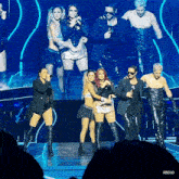 a group of people on a stage with the word rb03d on the bottom right