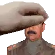 a hand is putting a hat on the head of a man with a mustache .