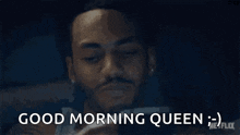 a man is holding his hand to his forehead and says good morning queen .