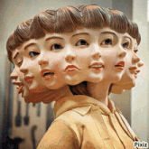 a statue of a woman has many faces on her head and the word pixiz is underneath it