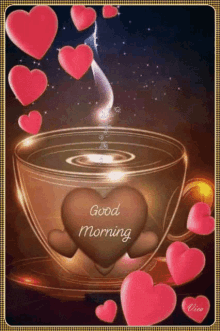 a cup of coffee with a heart in it and the words good morning written on it