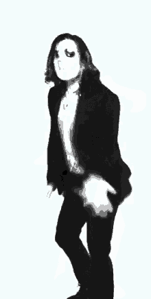 a black and white photo of a man wearing a mask