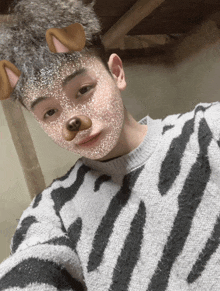 a young man wearing a zebra print sweater has a dog face mask on his face