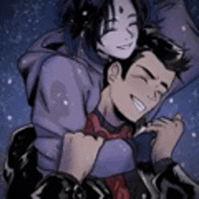a man and a woman are hugging each other in the dark .