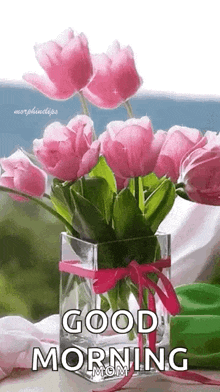a vase filled with pink flowers and the words `` good morning mom ''