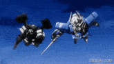a gif from gifrun.com shows two robots flying in the air
