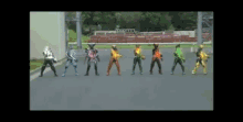 a group of action figures are lined up on the street