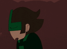 a cartoon character wearing a green mask with the letter t on it