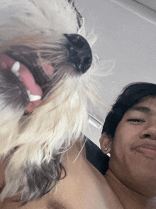 a man and a dog are posing for a photo