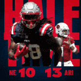 a patriots football player is holding a ball in his hand