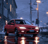 a red honda civic is parked on a wet street at night