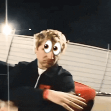 a man wearing a red hat has a cartoon face on his face