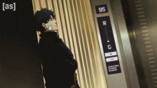 a man leaning against a wall next to an elevator that says 95 on it